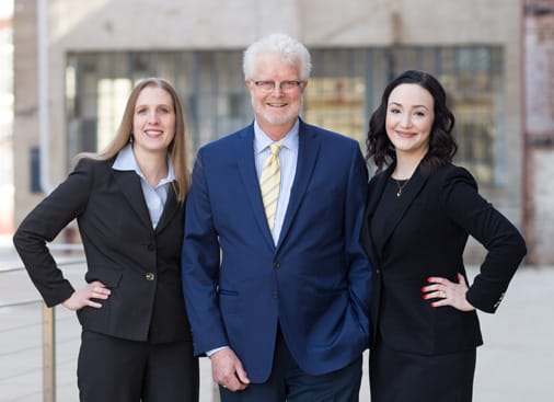 Photo of attorneys Karen Strom Talley, Perry C. Henson and Nicole R. Scallon